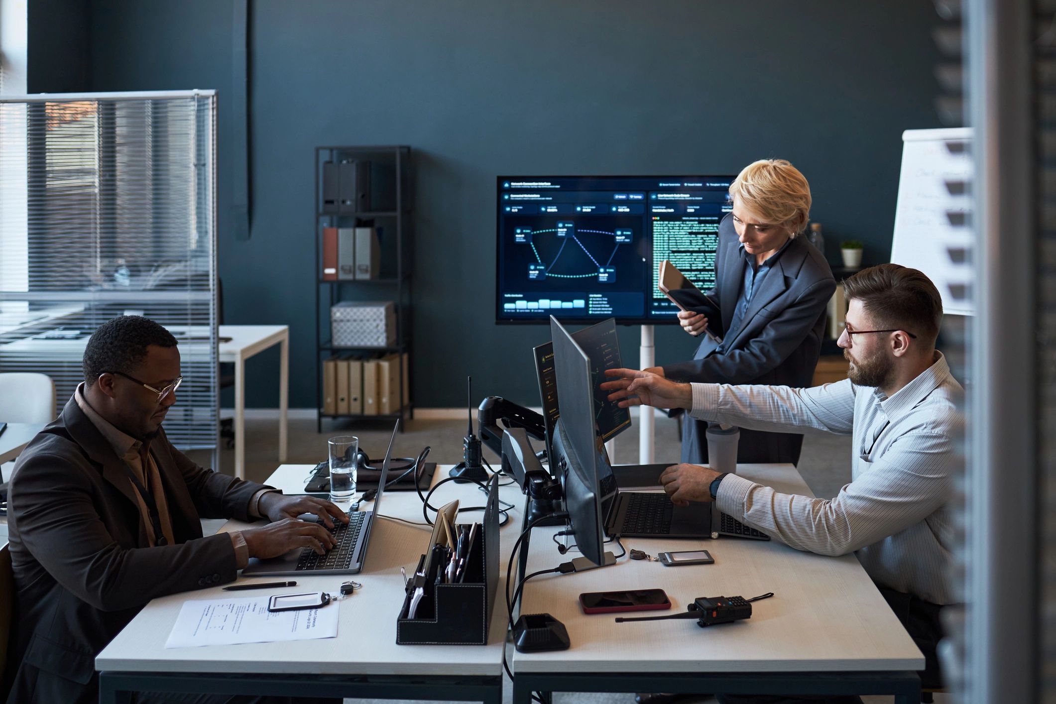 Diverse business team reviewing website analytics in a modern office